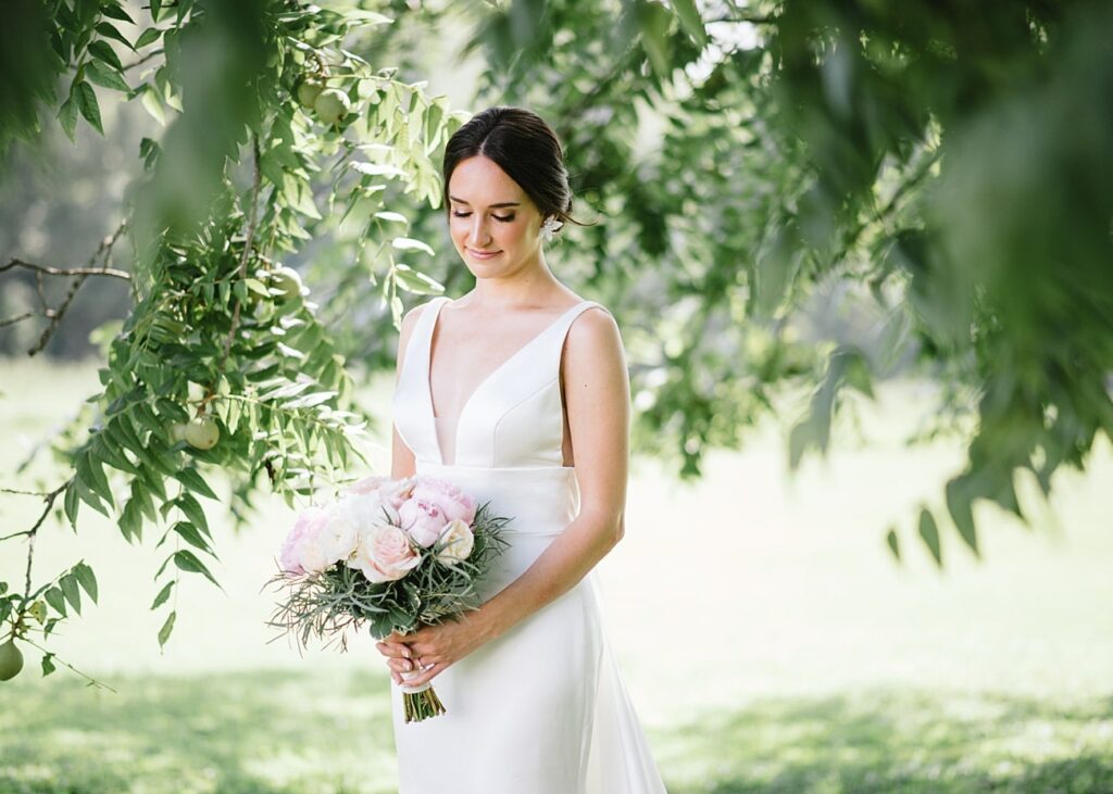 Bride posing under pecan tree in Aiken, South Carolina