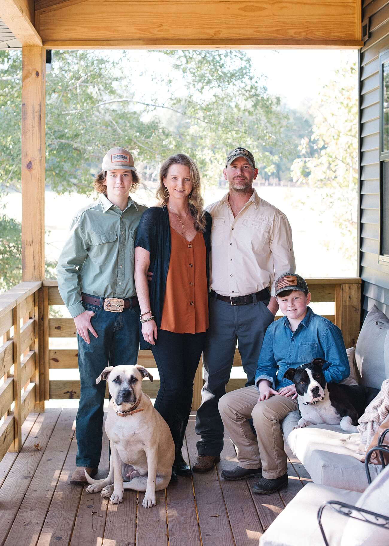 Family portraits with dogs on country front porch