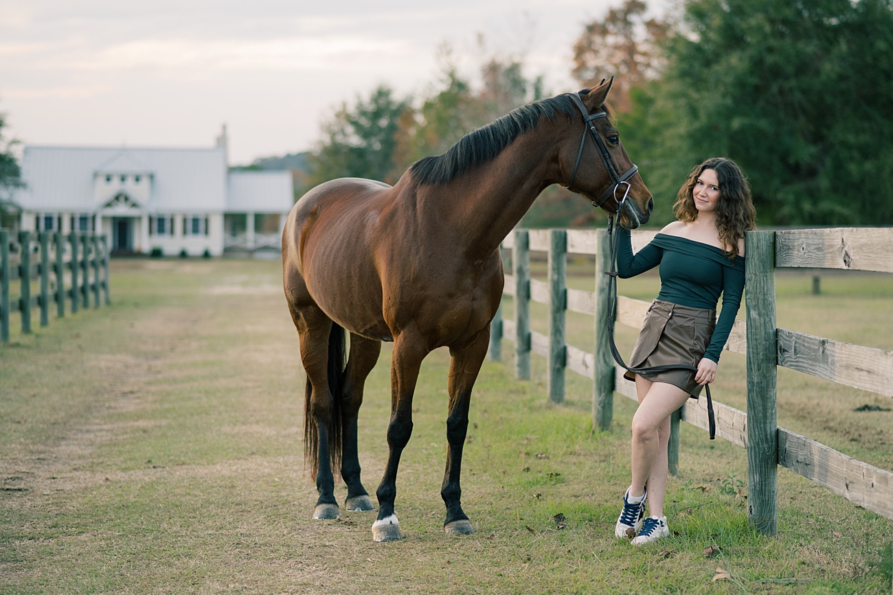 Beautiful outdoor natural light senior portraits in Aiken, SC with the girls horse